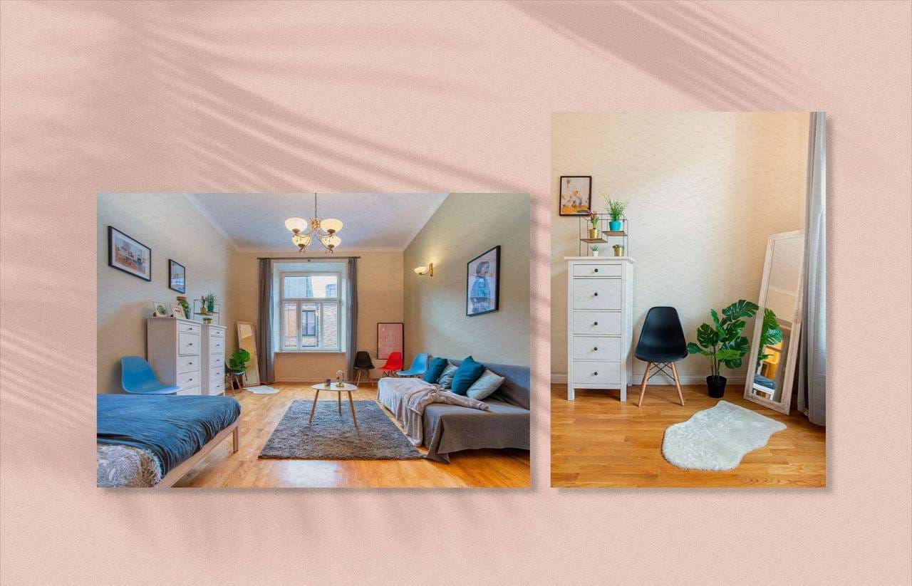 Un soggiorno moderno con divano, tavolino e TV a parete. Una piccola area adiacente presenta una cassettiera bianca, una sedia nera, una pianta e uno specchio a figura intera su un pavimento in legno, perfetto per rilassarsi dopo aver collaborato con l'agenzia web SHM sul tuo ultimo progetto.